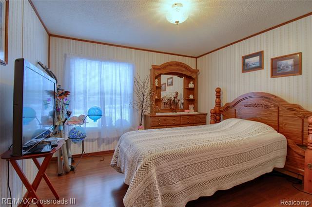 Builiding view eighteen for 48620 Wear, Belleville, MI. 48111