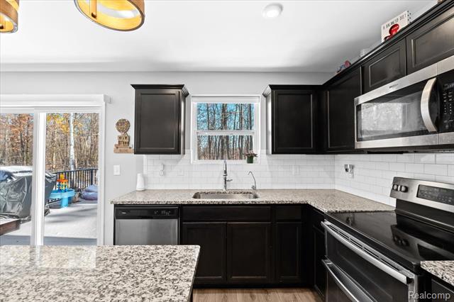 Builiding view ten for 220 Laura, Linden, MI. 48451