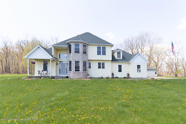 front view for 243 N Aurelius Road, Mason, Mi. 48854