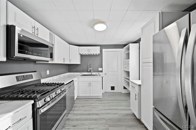 Builiding view ten for 313 Rice, Adrian, MI. 49221