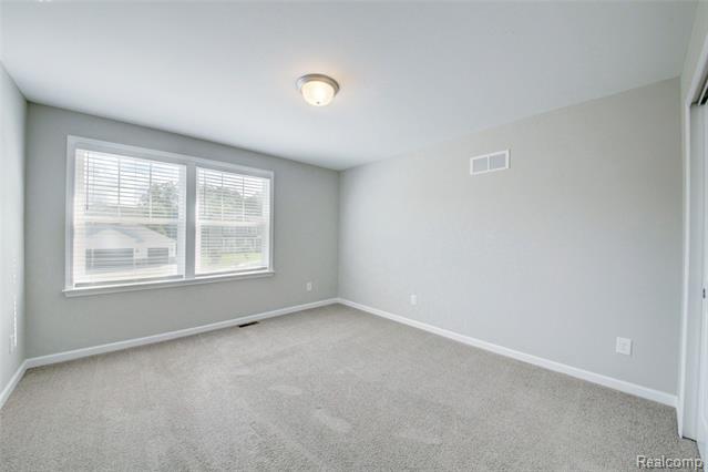 Builiding view eighteen for 3040 Bogues View Drive, Howell, MI. 48843