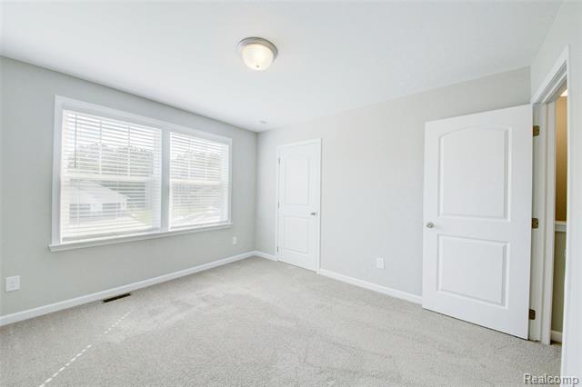 Builiding view fifteen for 3040 Bogues View Drive, Howell, MI. 48843