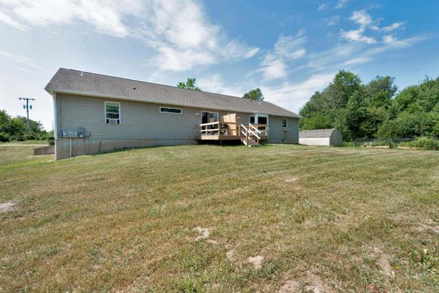 Builiding view thirty eight for 879 Flat River, Lowell, MI. 49331