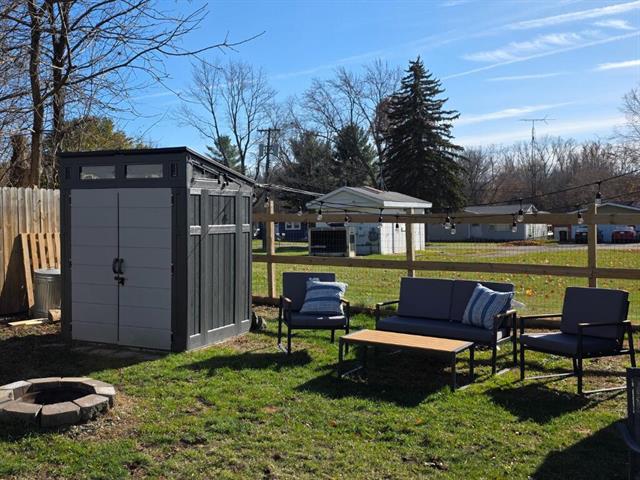 Builiding view twelve for 417 Maple, Webberville, MI. 48892