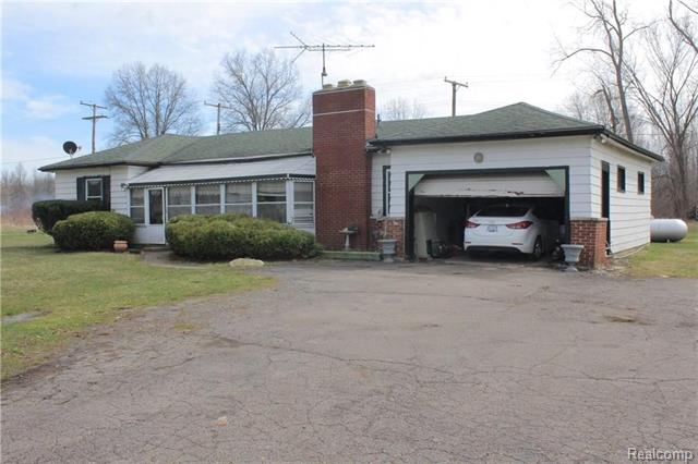 front view for 6305 Oakville Waltz Road, Carleton, Mi. 48117