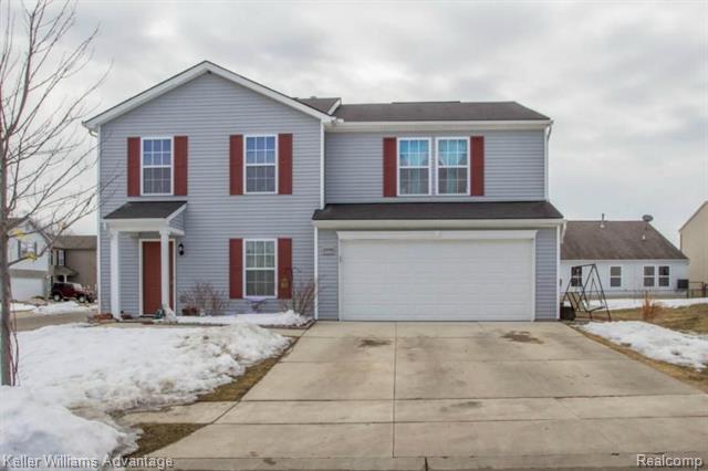 front view for 8553 Shiawassee River Drive, Fowlerville, Mi. 48836