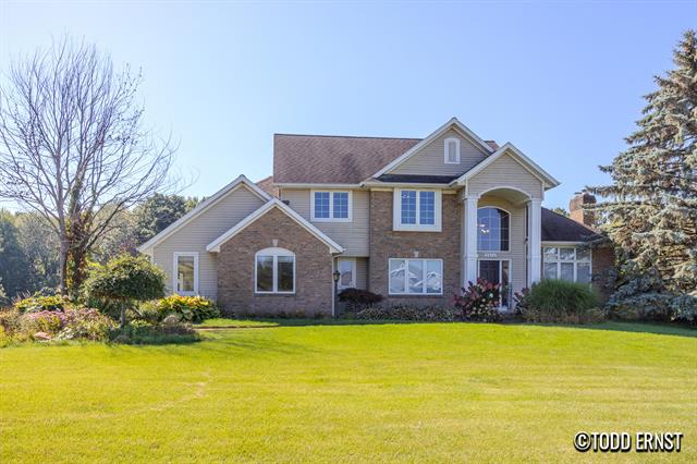 front view for 5814 Cannon Hillsne Drive, Ada, Mi. 49301