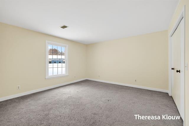 Builiding view forty for 17496 Meadow Wood, Spring Lake, MI. 49456