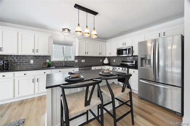 Builiding view nine for 57351 Blossom Valley, New Hudson, MI. 48165