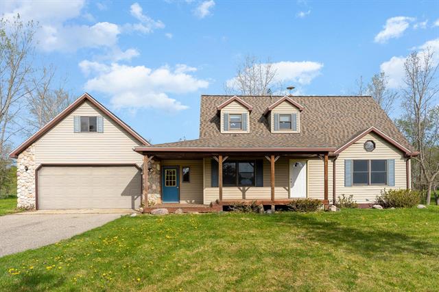 front view for 11399 Six Lakes Road, Six Lakes, Mi. 48886