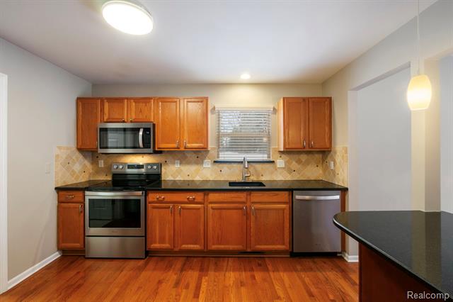 Builiding view nineteen for 671 Woodhaven, Walled Lake, MI. 48390