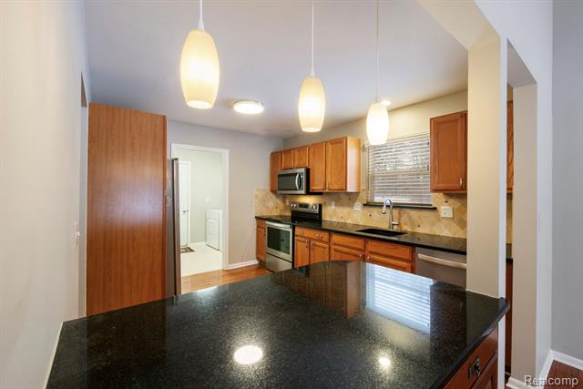 Builiding view sixteen for 671 Woodhaven, Walled Lake, MI. 48390