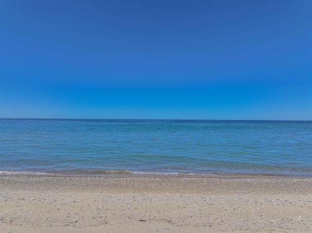 Builiding view fifty eight for 5635 Leland Woods, Leland, MI. 49654