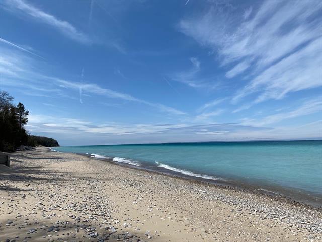 Builiding view fifty nine for 5635 Leland Woods, Leland, MI. 49654