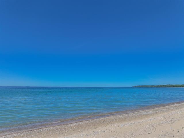 Builiding view fifty seven for 5635 Leland Woods, Leland, MI. 49654