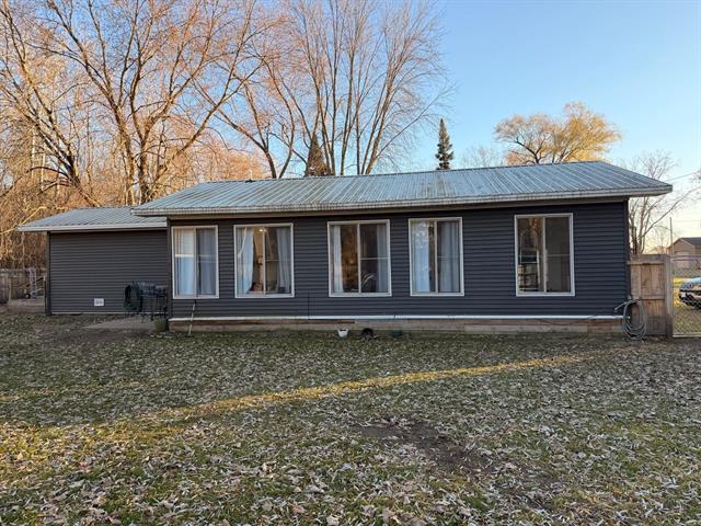 front view for 7986 Little Penny Lane, Six Lakes, Mi. 48886