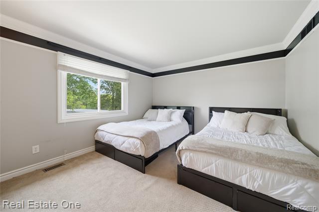 Builiding view thirty for 219 Briarwood, Highland, MI. 48357