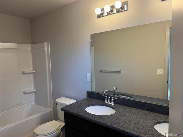 Builiding view twenty seven for 56054 Madison, New Hudson, MI. 48165