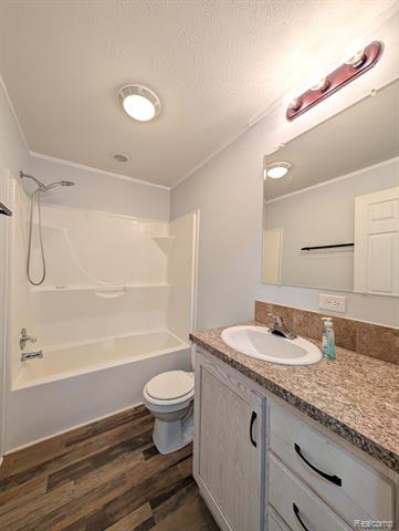 Builiding view ten for 11045 Woodland Ridge, South Lyon, MI. 48178