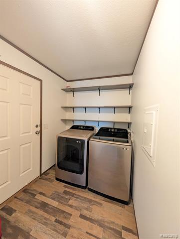 Builiding view twenty one for 11045 Woodland Ridge, South Lyon, MI. 48178