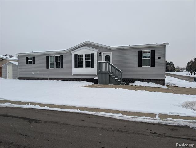 front view for 11045 Woodland Ridge Court, South Lyon, Mi. 48178