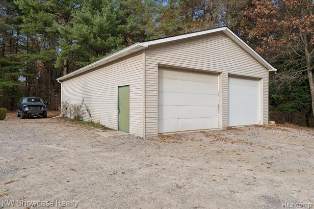 Builiding view thirty five for 1045 Tall Pines, Highland, MI. 48356