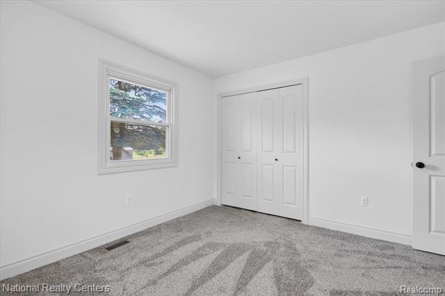 Builiding view thirty one for 2601 Westwind, Highland, MI. 48357
