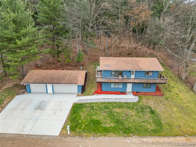 Builiding view thirty two for 9900 S Big School Lot Lake, Holly, MI. 48442