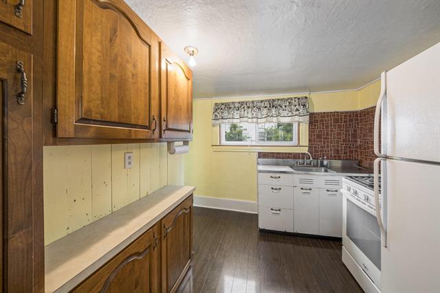 Builiding view nine for 128 1St, Milan, MI. 48160