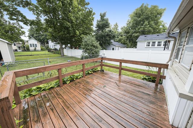 Builiding view twenty one for 128 1St, Milan, MI. 48160