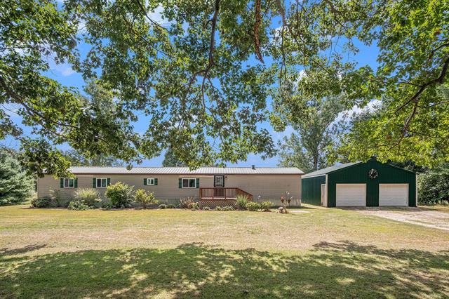 front view picture of 13660 18 Mile Road, Gowen, MI. 49326