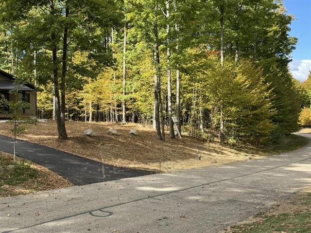 Builiding view thirty for 2418 Hawks Eye, Bellaire, MI. 49615