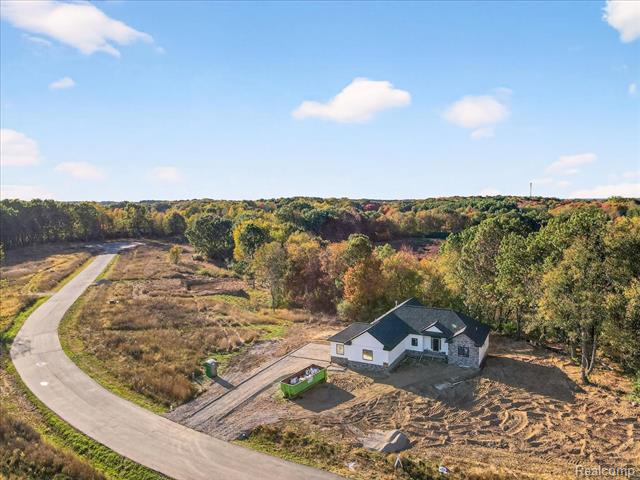 Builiding view thirty seven for 4050 Metamora Ridge, Metamora, MI. 48455