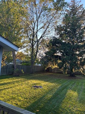 Builiding view six for 203 Adams, East Tawas, MI. 48730