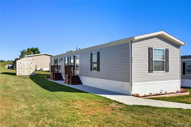 front view for 230 E Macgregor Court, Highland, Mi. 48357