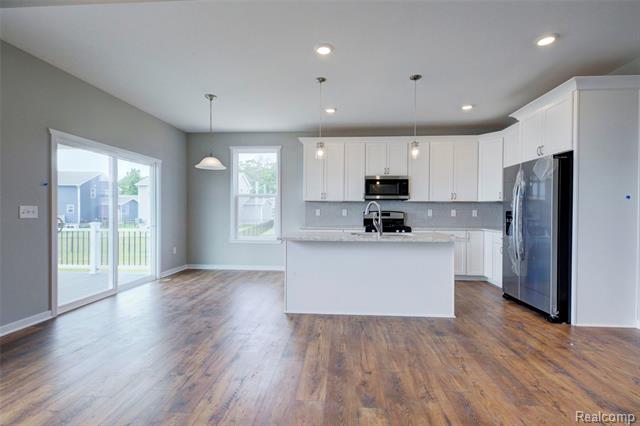 Builiding view nine for 659 Round Rock Dr, Howell, MI. 48843
