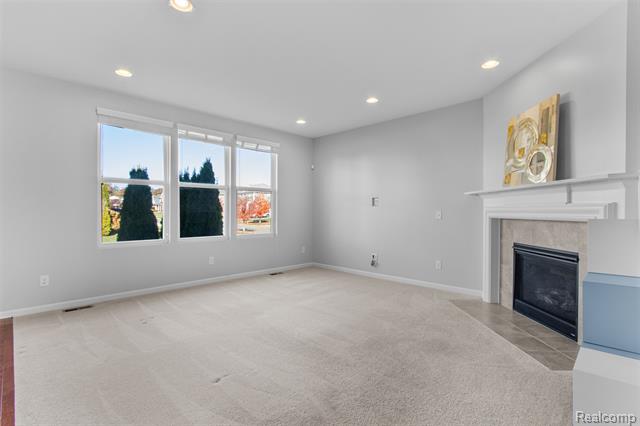 Builiding view eight for 57570 Village, New Hudson, MI. 48165