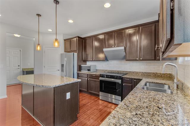 Builiding view eighteen for 57570 Village, New Hudson, MI. 48165