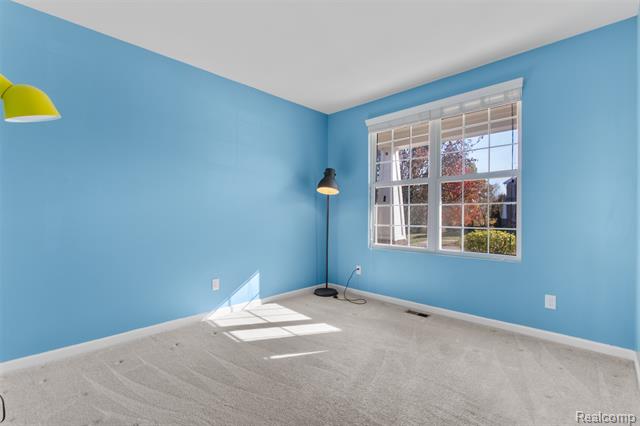 Builiding view five for 57570 Village, New Hudson, MI. 48165