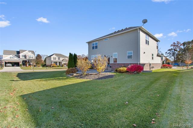 Builiding view forty two for 57570 Village, New Hudson, MI. 48165