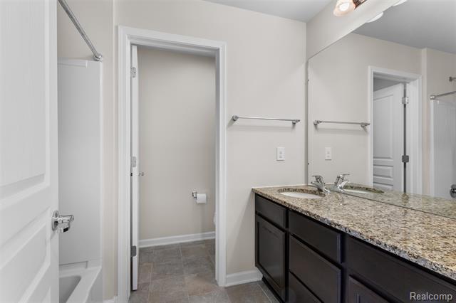 Builiding view thirty three for 57570 Village, New Hudson, MI. 48165