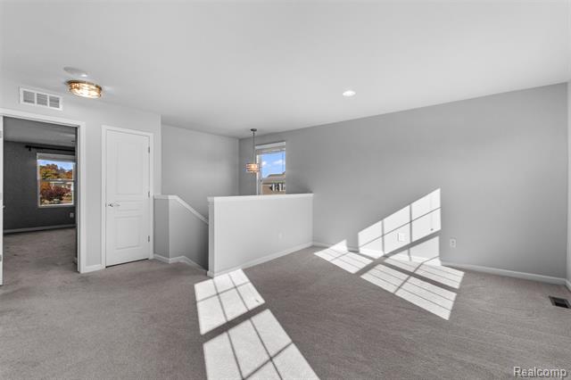 Builiding view twenty three for 57570 Village, New Hudson, MI. 48165