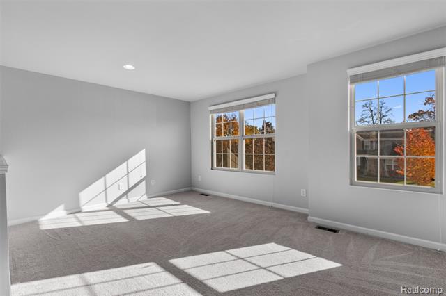 Builiding view twenty two for 57570 Village, New Hudson, MI. 48165