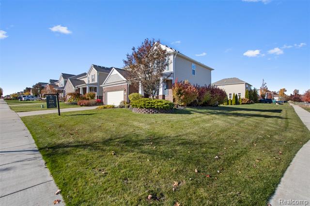 Builiding view two for 57570 Village, New Hudson, MI. 48165