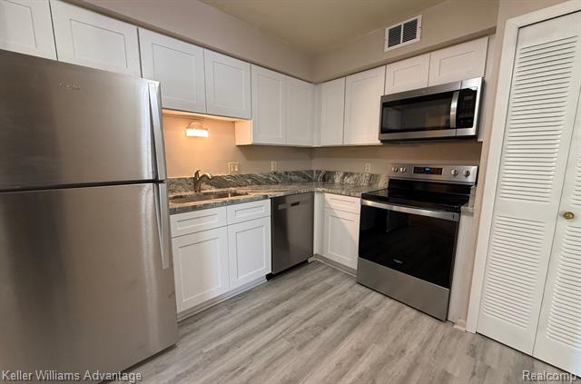 Builiding view eleven for 30709 Shiawassee # 65, Farmington, MI. 48336