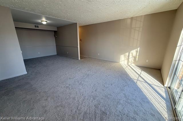 Builiding view three for 30709 Shiawassee # 65, Farmington, MI. 48336