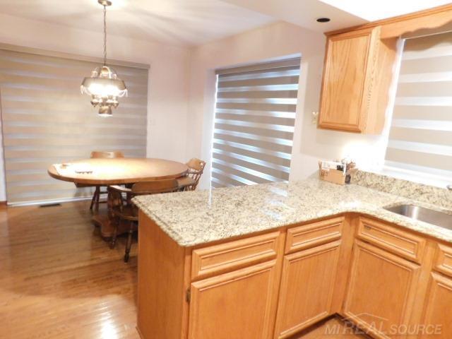 Builiding view eight for 48515 Hidden Oaks, Utica, MI. 48317