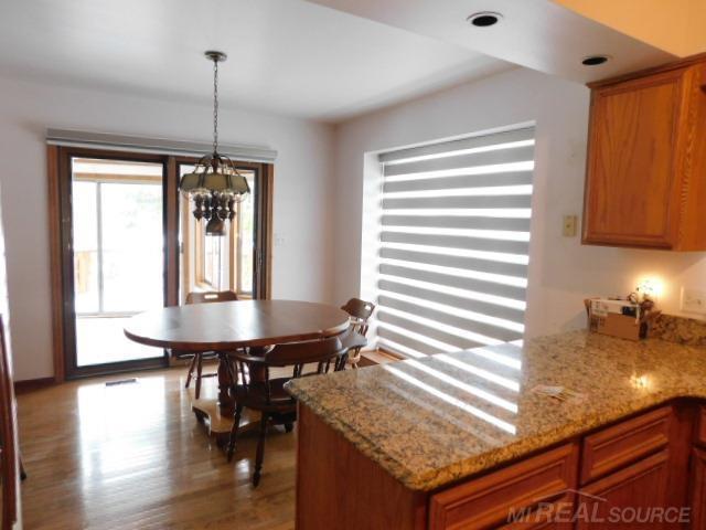 Builiding view nine for 48515 Hidden Oaks, Utica, MI. 48317