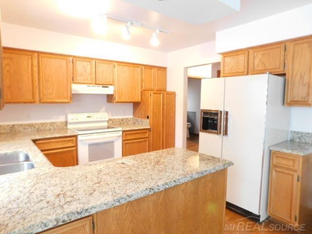 Builiding view seven for 48515 Hidden Oaks, Utica, MI. 48317