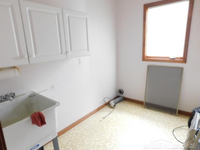 Builiding view ten for 48515 Hidden Oaks, Utica, MI. 48317